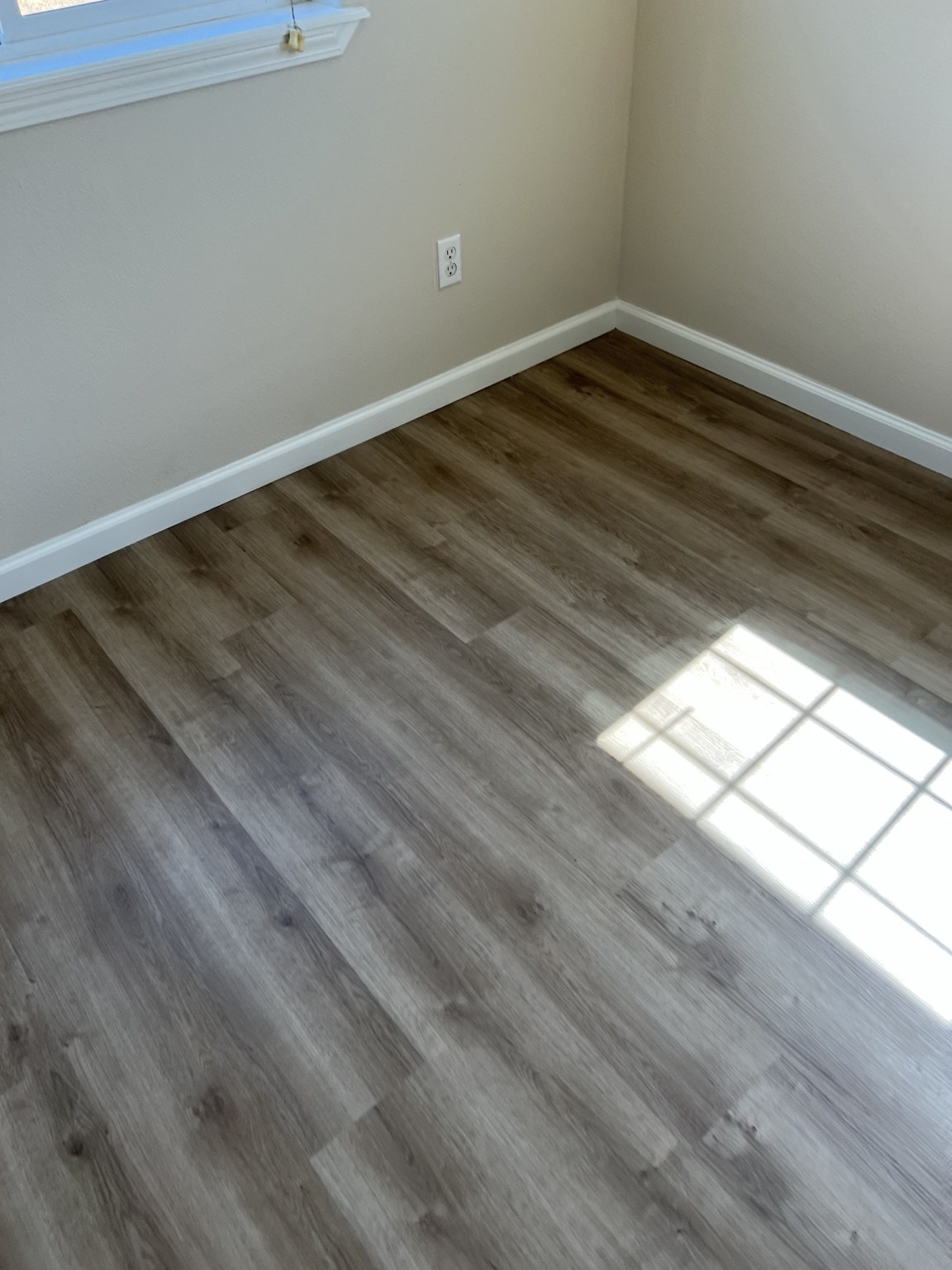 Flooring and baseboard finish detail
