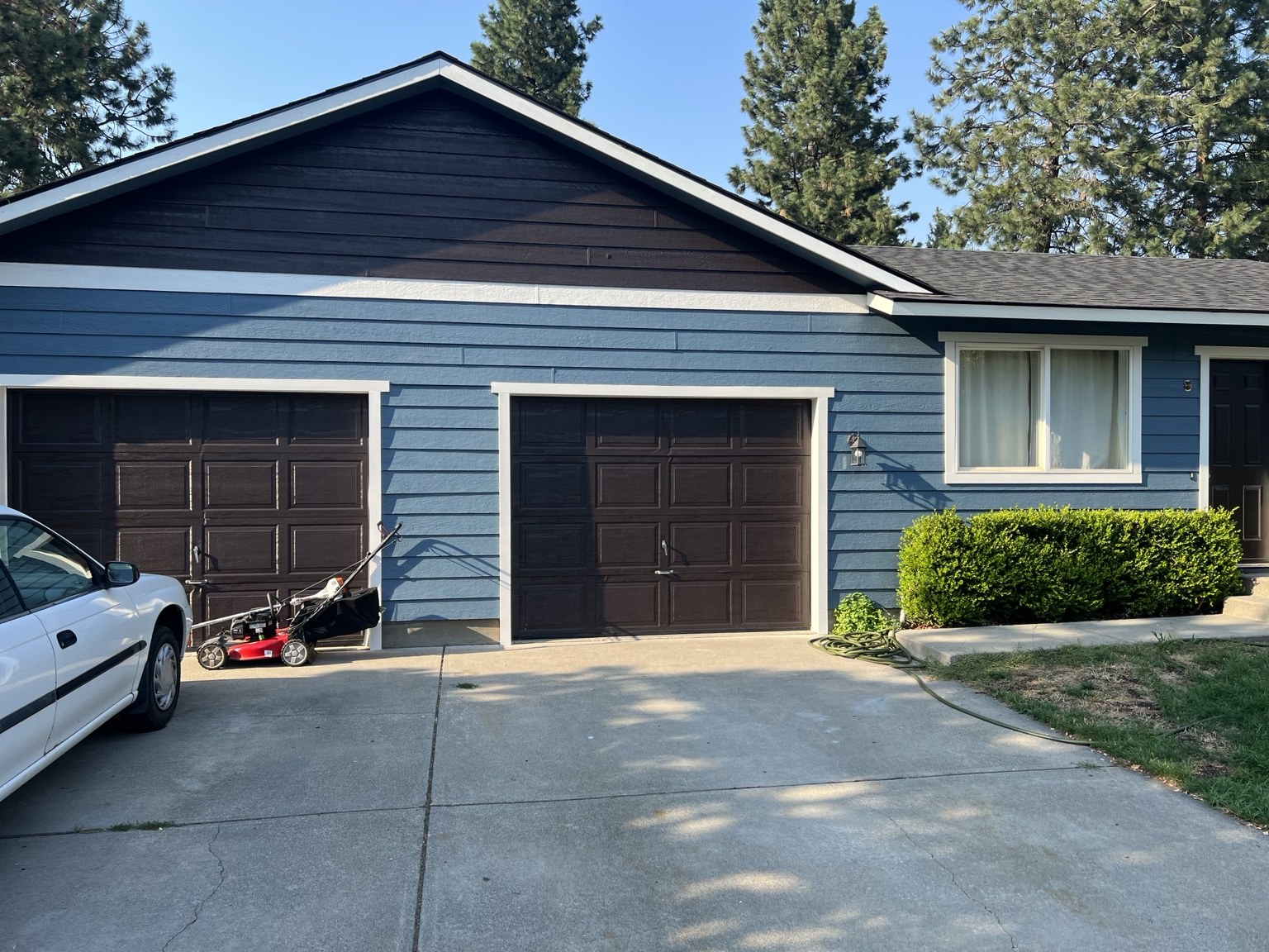 Blue exterior siding with contrasting white trim